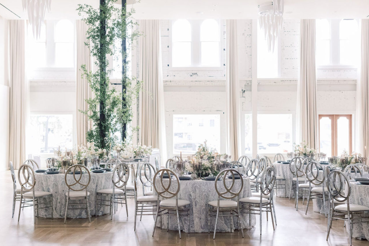 Elegant white room with banquet tables at our hotel near Ybor City in Tampa