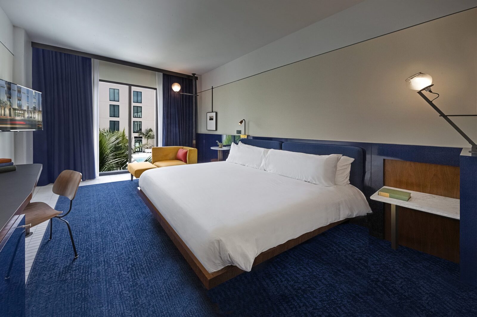 Tampa, Florida hotel room featuring a large window and dark blue decor