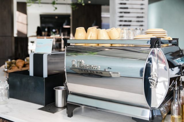 Stacks of clean coffee mugs on a counter at our hotel in Ybor City, Tampa