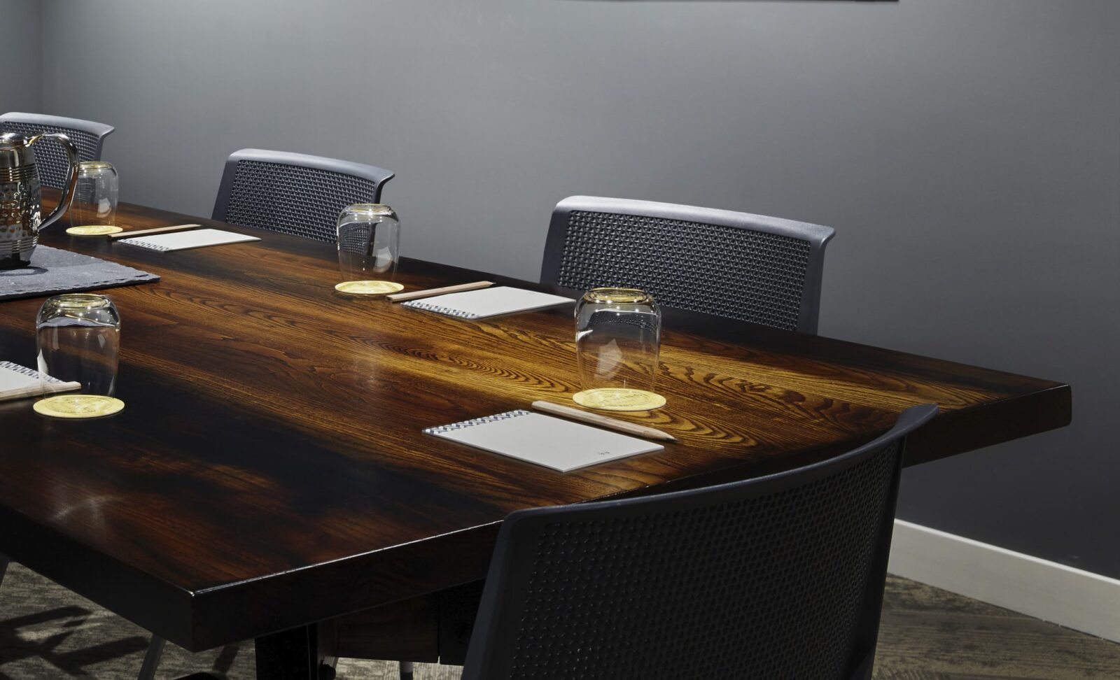 Empty water glasses and notepads in a meeting room at our hotel in Ybor City, FL