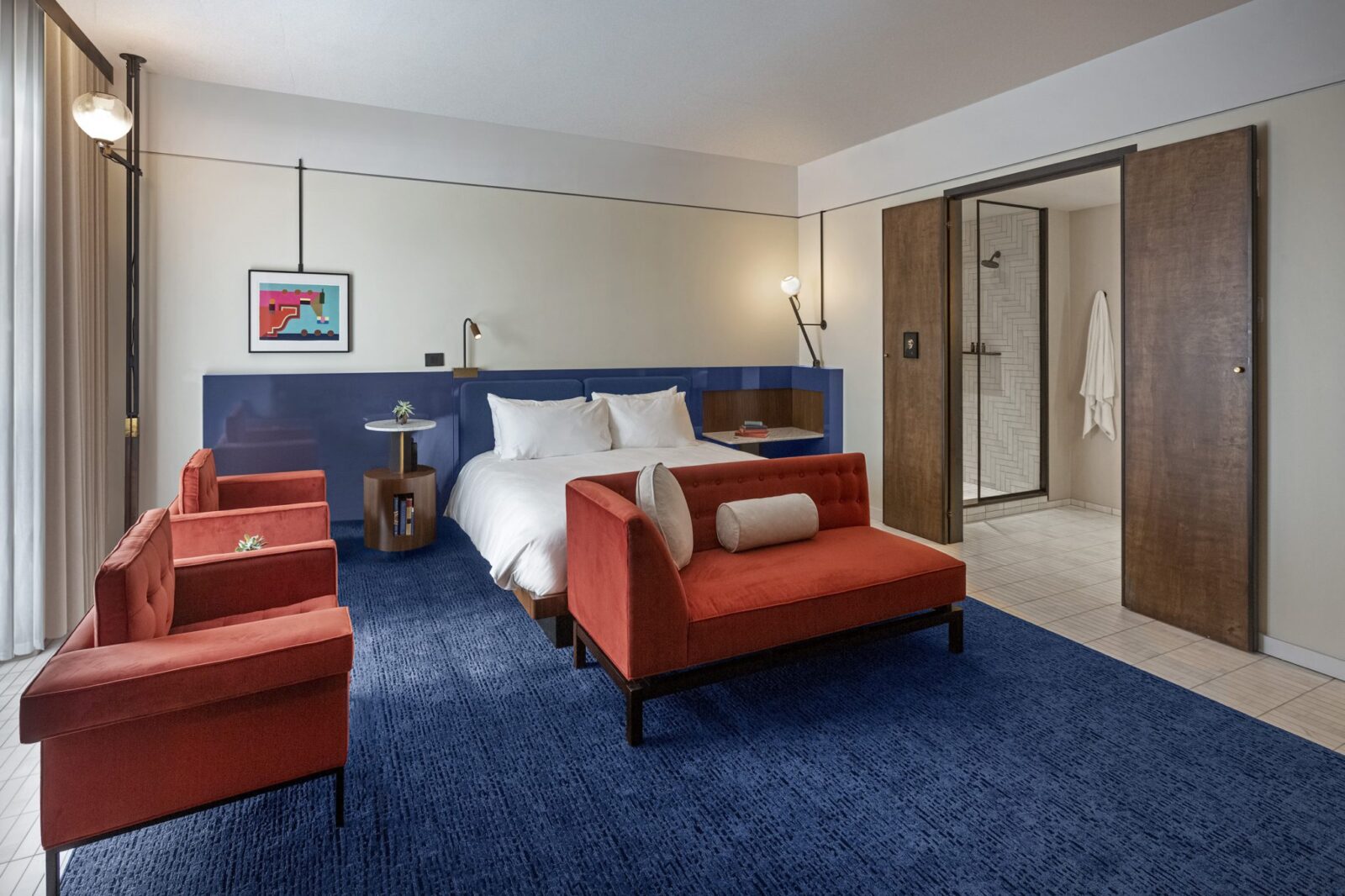 Cozy hotel room with a bed and seating at our hotel in Ybor City, FL