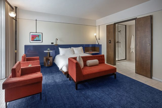 Cozy hotel room with a bed and seating at our hotel in Ybor City, FL