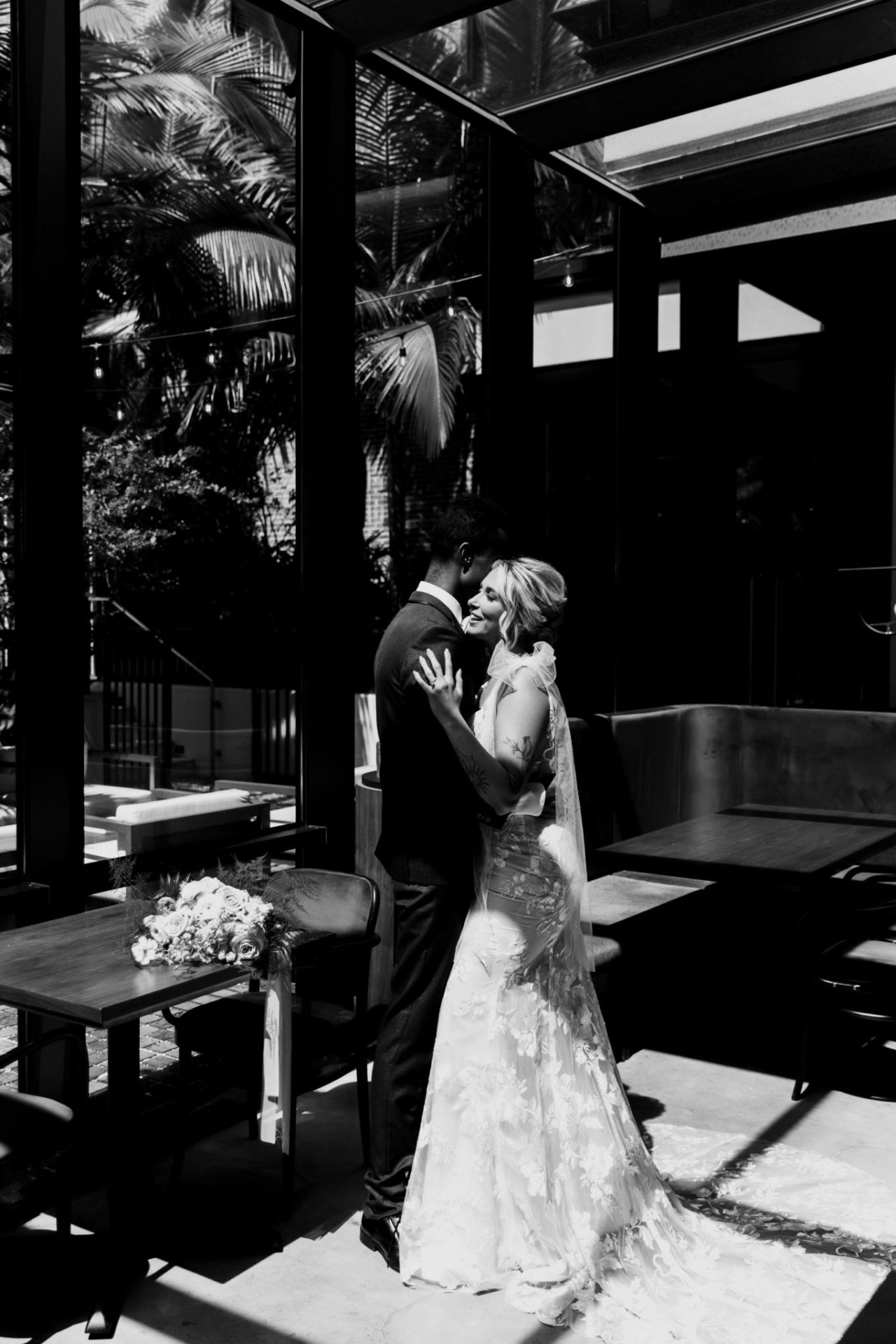 Black and white image of a bride and groom dancing at our Ybor City hotel
